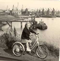Photograph of child on bike at docks in North Shields