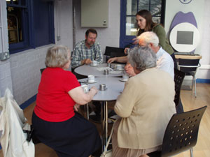 Photograph of Alex supervising tea and scones Photograph of Alex supervising tea and scones