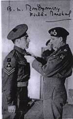 Photograph showing Bill Harmon receiving his medal from Montgomery